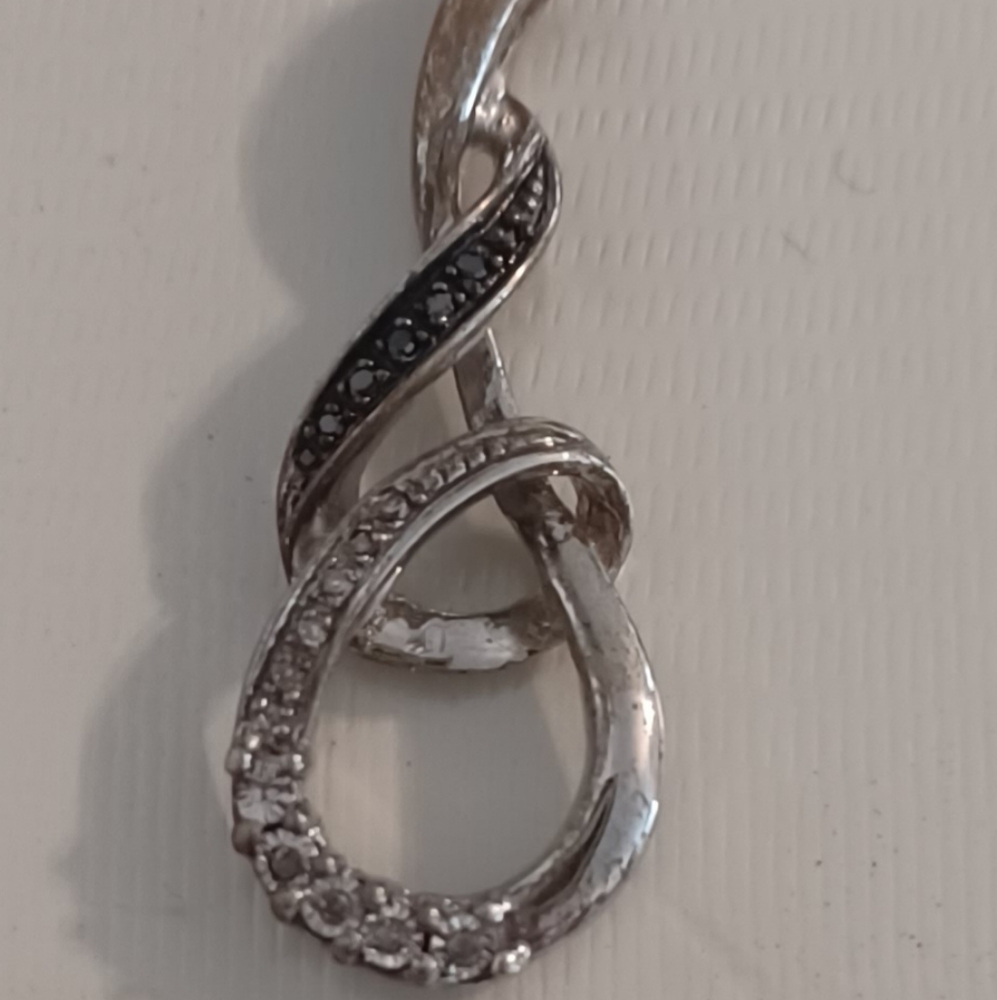 White sapphire and black diamond pendant